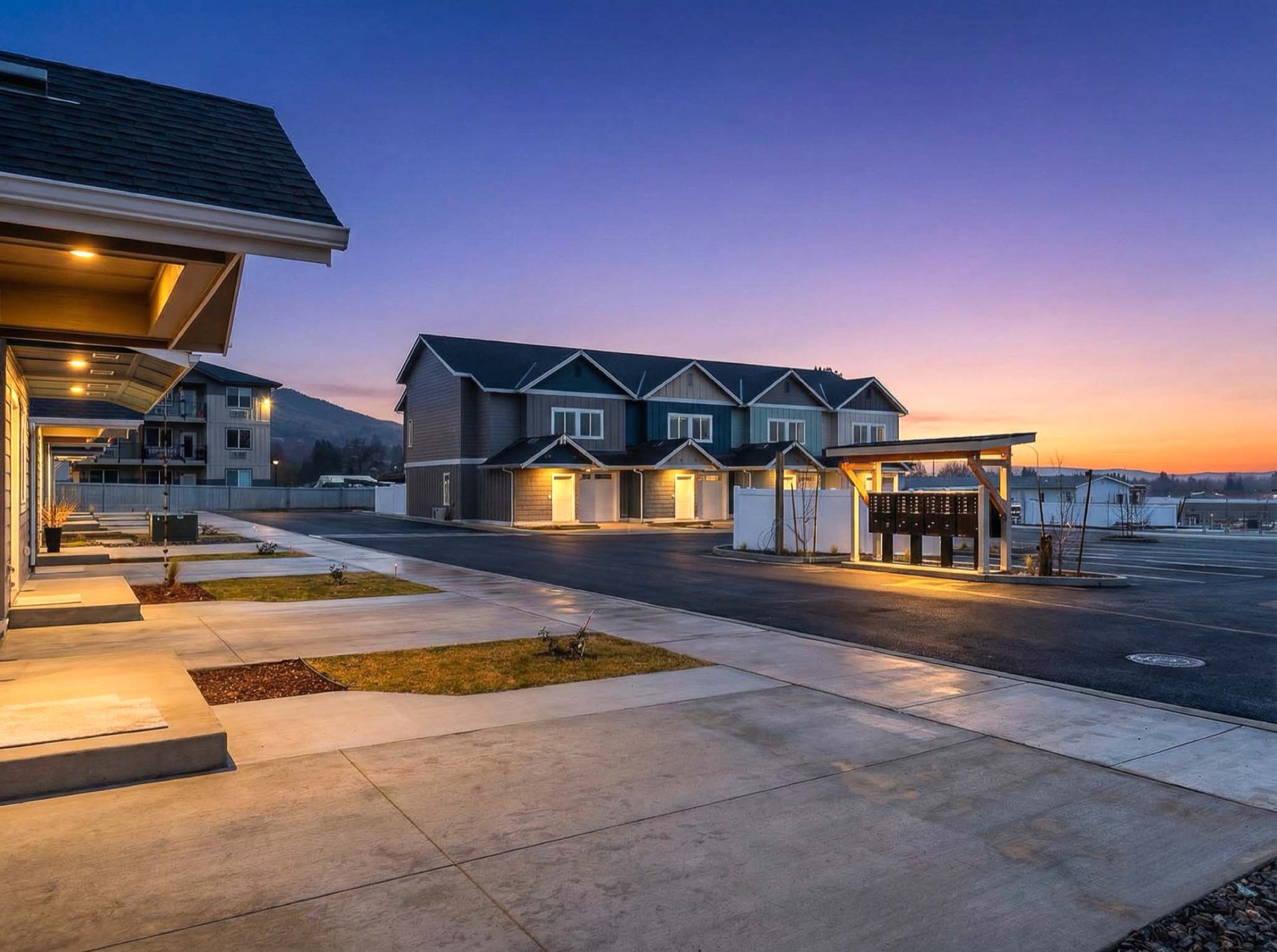 Red Apple Townhomes exterior at dusk (community photo; not F21's own finished interior)